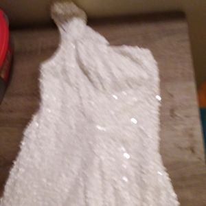Great all white flawless sequin dress. Runched a bit in front.